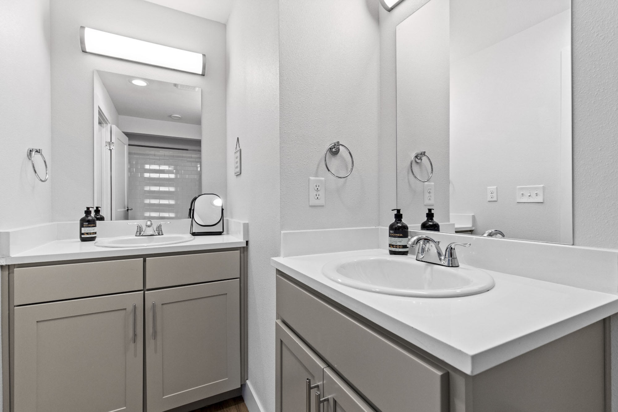 Shared bathroom with two vanities at The Junction