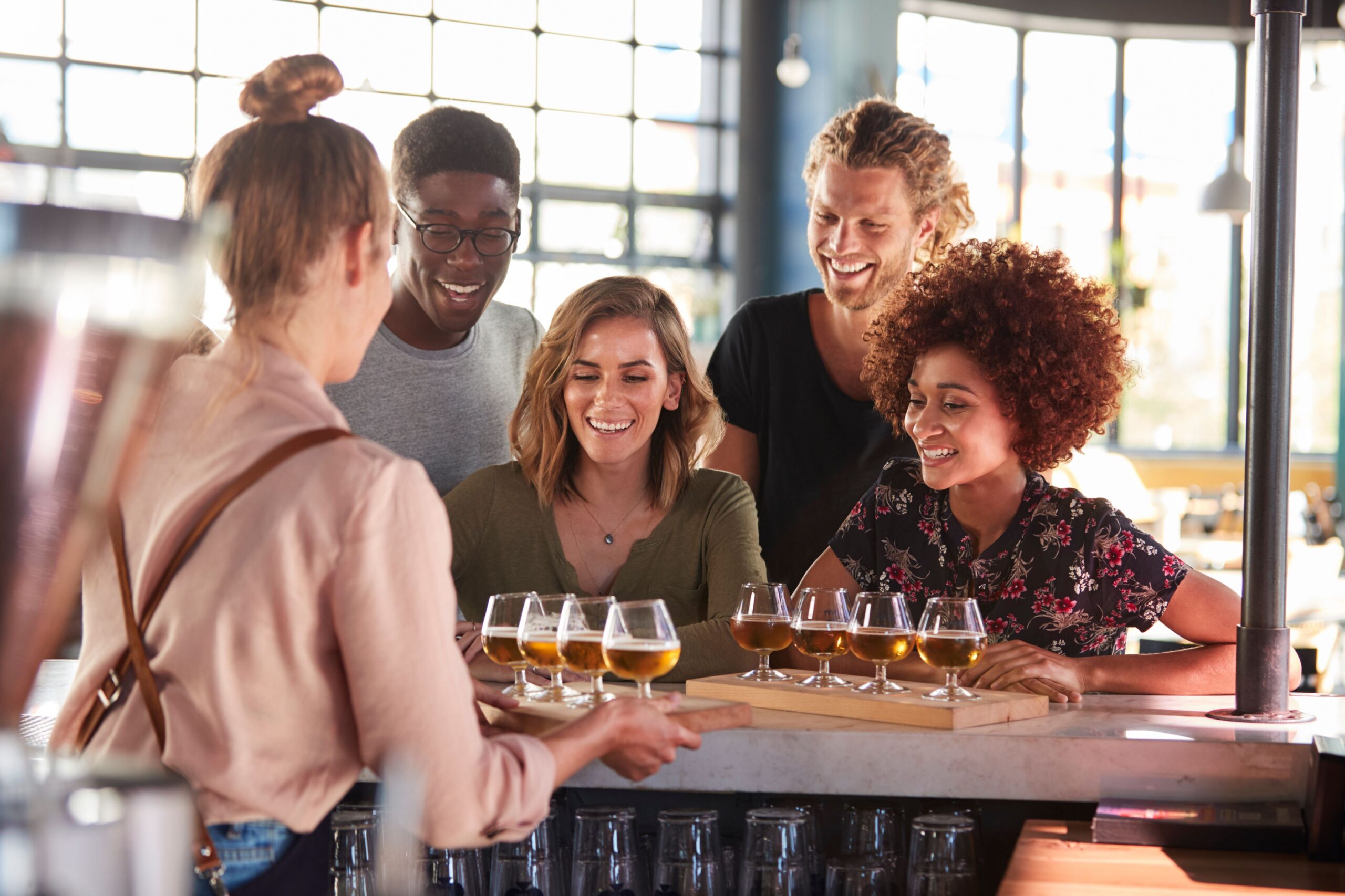 bartender serving craft beer flights scaled