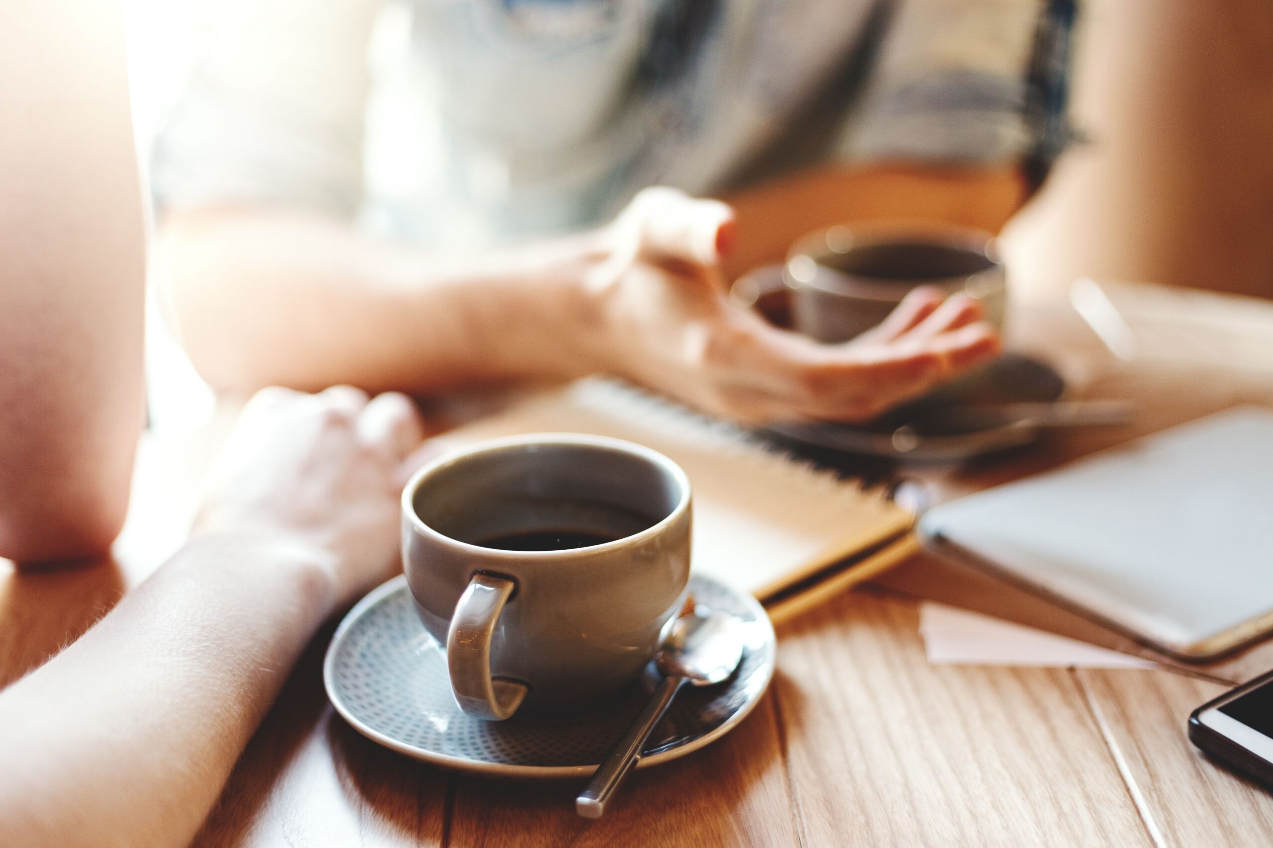 informal business meeting at cafe scaled